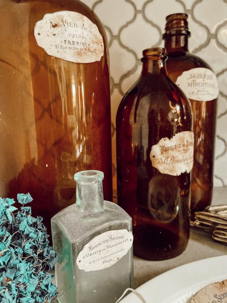 Add DIY Vintage Labels to Amber Bottles for fall decorating.  