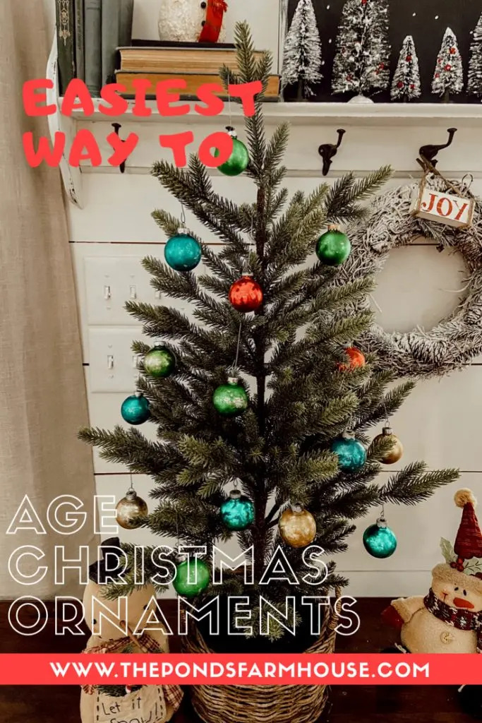 Here is the absolute easiest way to age new Christmas Ornaments to make them look like vintage shiny brites.  Make your new ornaments have a rustic, faded appearance using this no mess method.  Only takes minutes to create a whole tree full of antique looking ornaments.  