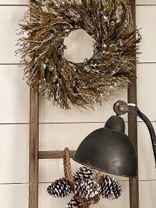 Add flocking to wreath and pinecones for updated Christmas Decorating.