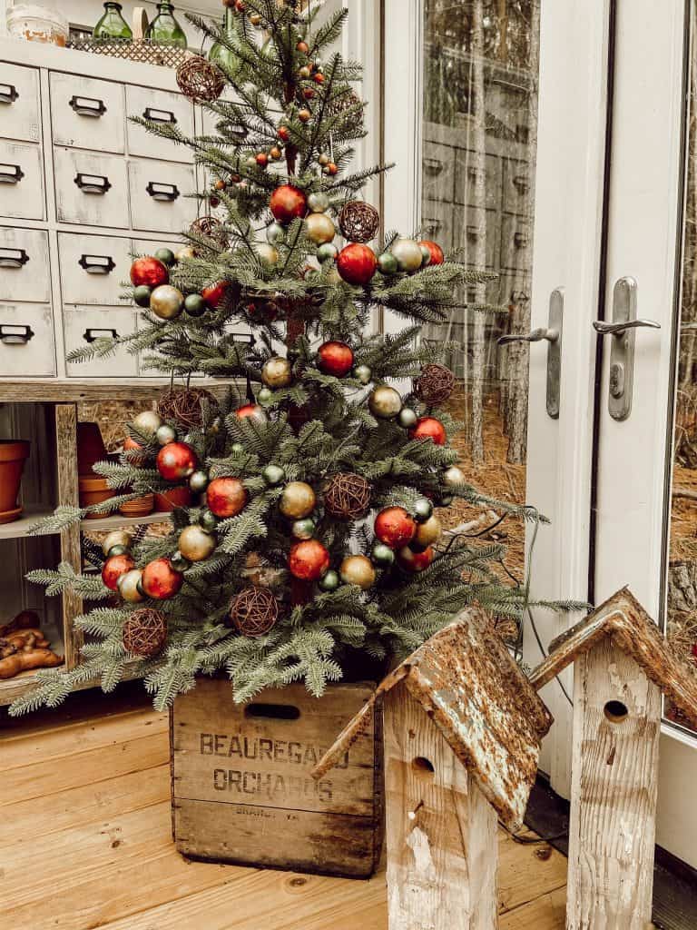 DIY Birdhouse Project, old wooden crate holds vintage inspired decorated Christmas tree in 
 DIY Greenhouse Christmas Tree