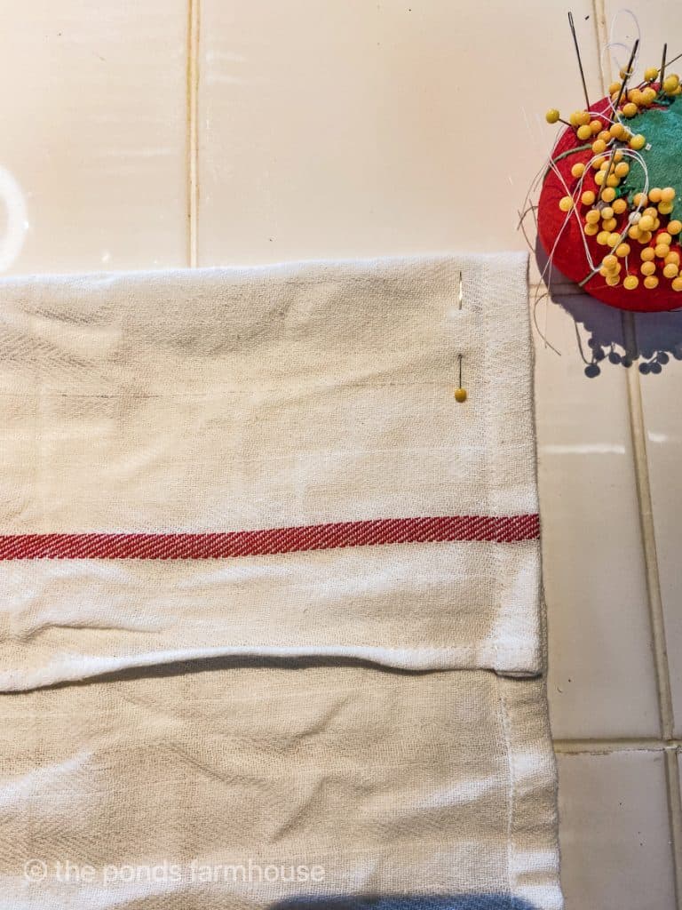 Pin tea towel together for DIY Garden Craft Apron