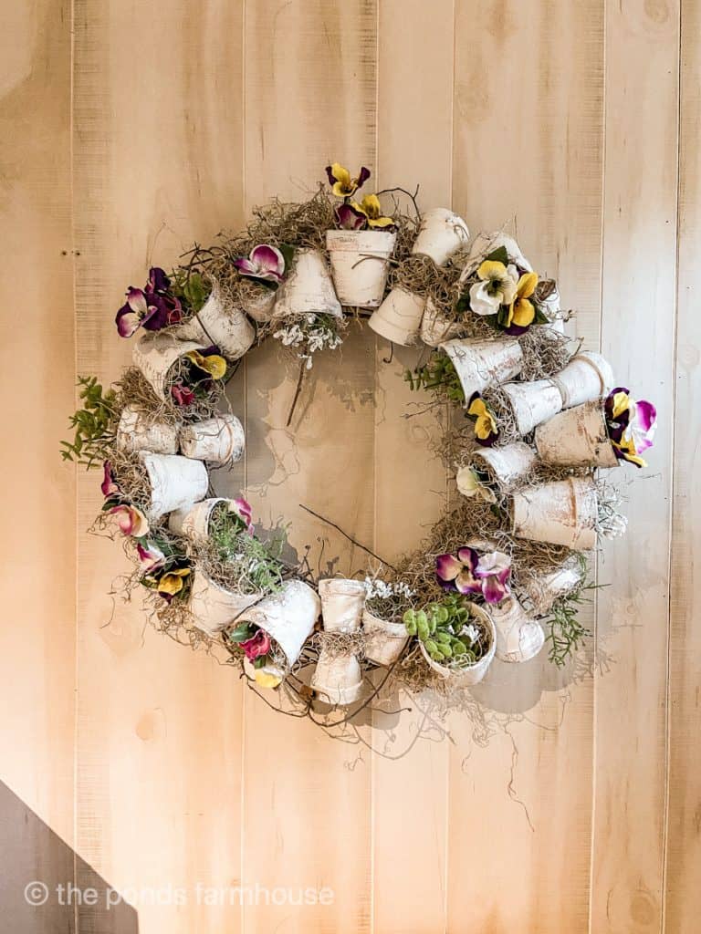 Easy Spring wreath ideas made with small terra cotta clay pots for outdoor use.