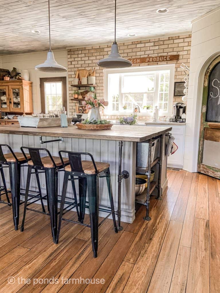 DIY Industrial Farmhouse Kitchen Island with low back bar stools for modern decorating style.