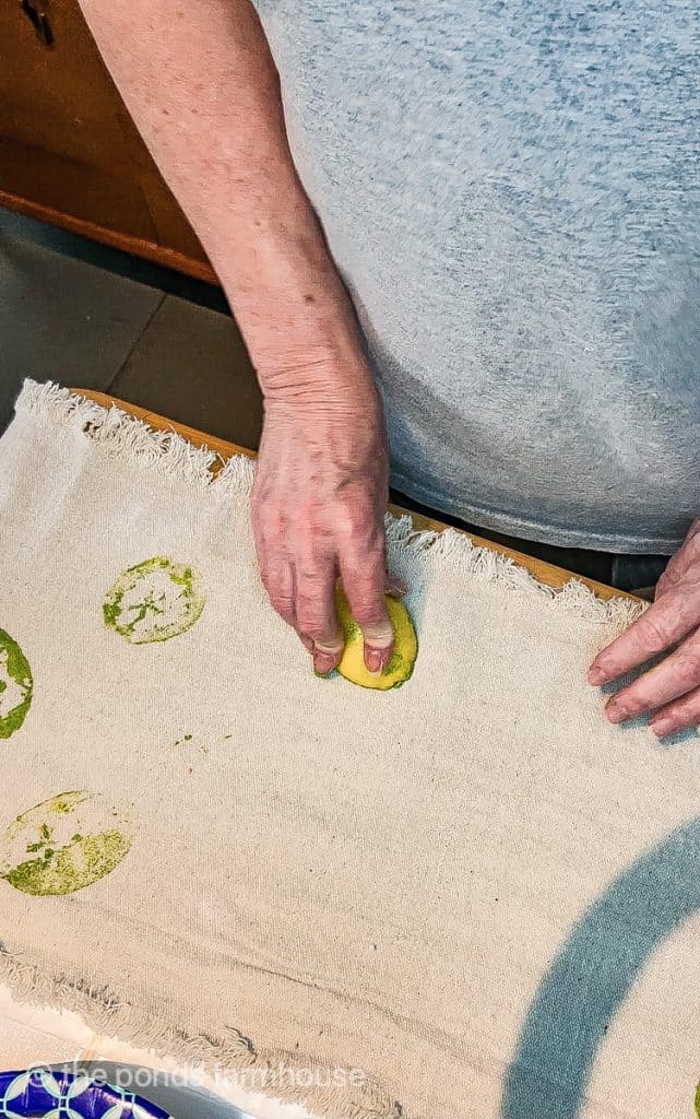 Table Runner DIY Project using real lemons and limes to stamp fruit designs on drop cloth.