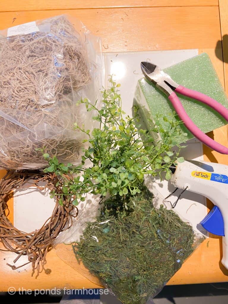 Supplies to make a DIY Climbing Topiary with faux greenery.