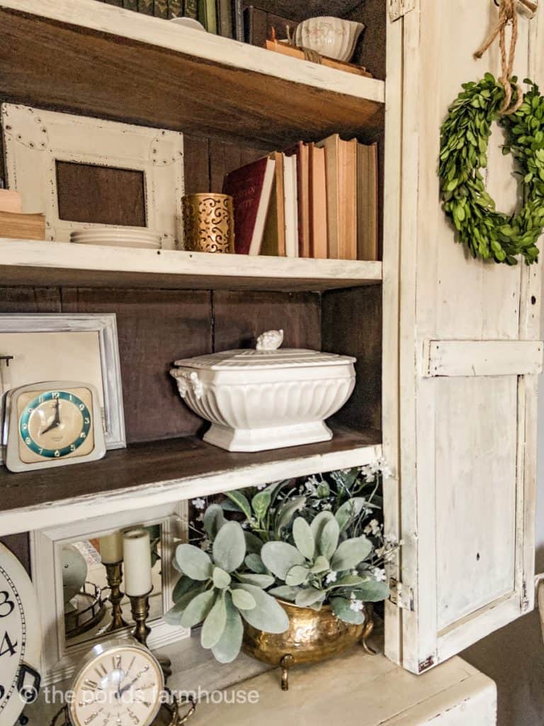 Decorate shelves with old books, greenery, vintage clocks & ironstone.