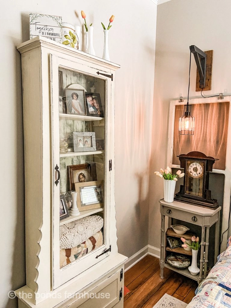 Vintage DIY Gun Cabinet Repurposed into storage and photo display cabinet.