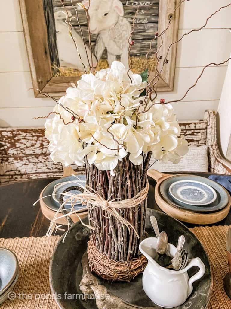 DIY Hydrangea flower arrangement with faux twigs and real twigs vase. Rustic farmhouse style centerpiece