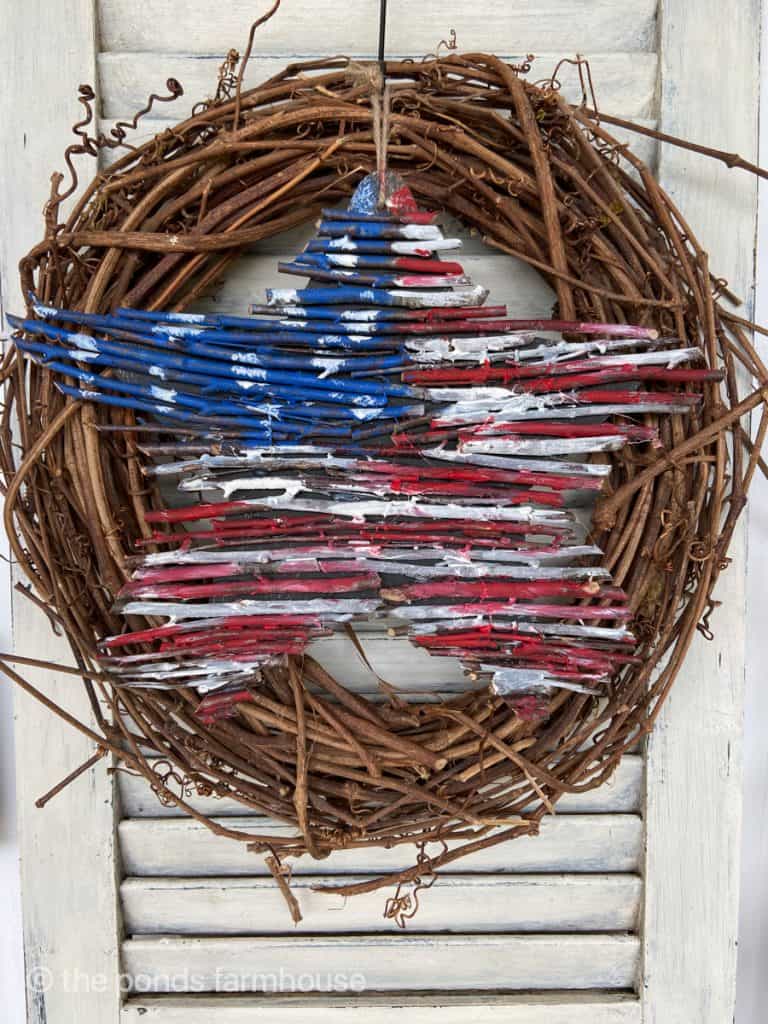 Patriotic Wooden star attached to grapevine wreath. Eco-friendly sustainable DIY project.