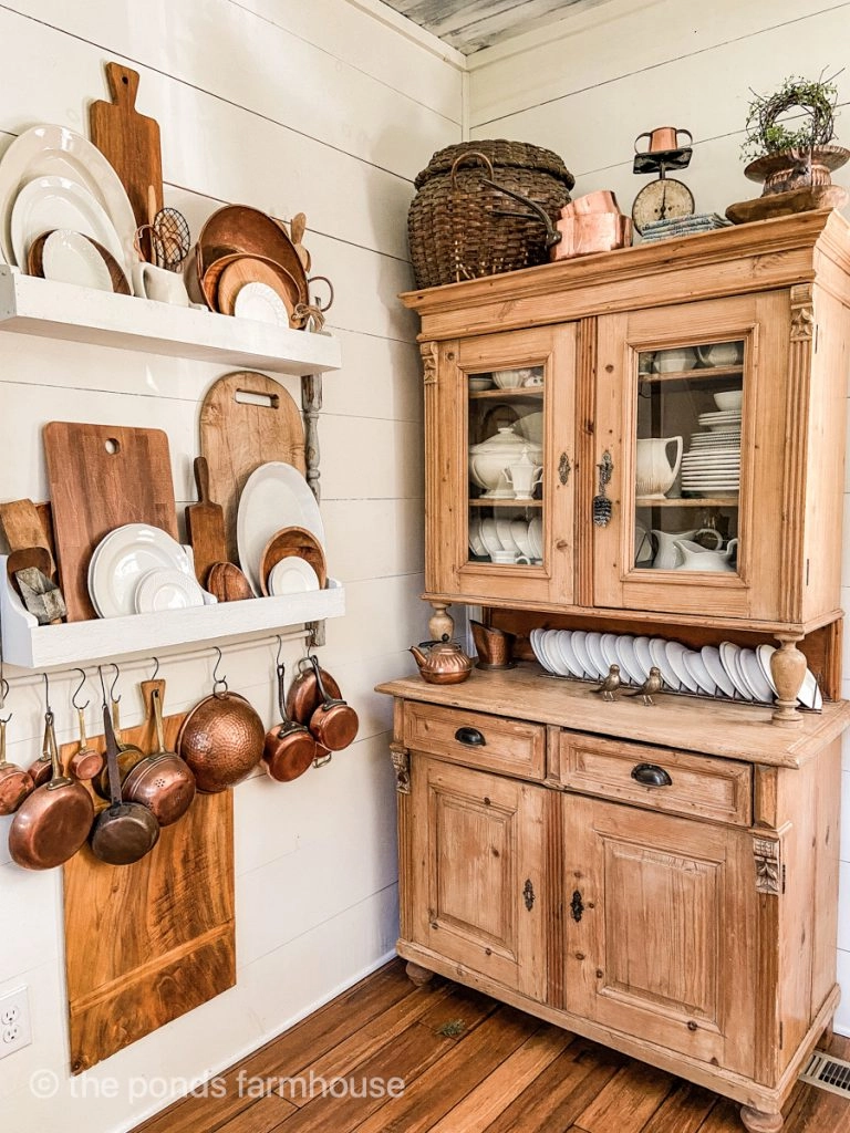 Antique hutch with vintage copper, breadboards and collections of vintage ironstone on a DIY plate rack