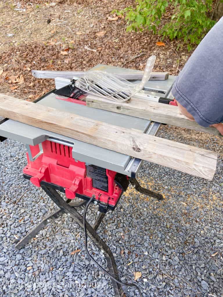 Split wood with table saw for recycled DIY project with reclaimed wood.