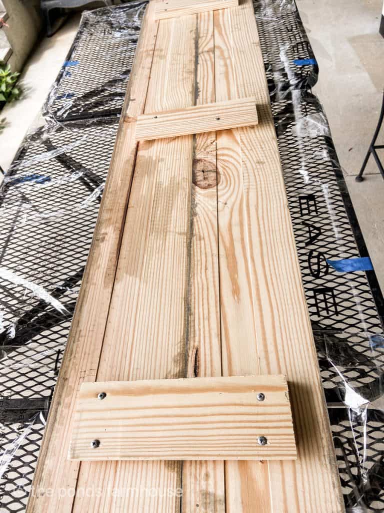 Add wooden strips to back of boards to attach together