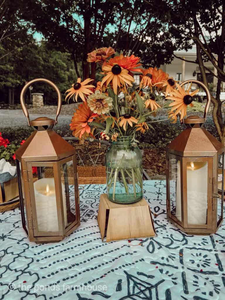 outdoor lanterns spray painted copper for Summer outdoor picnic table setting.