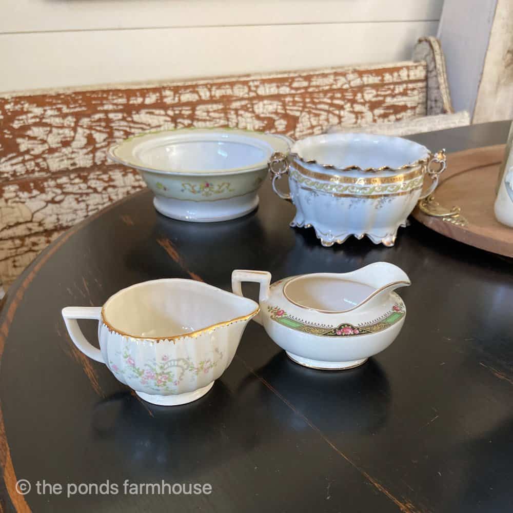 Bowls with missing lids and creamers without sugar bowls can still be used to decorate for cheap home decor.