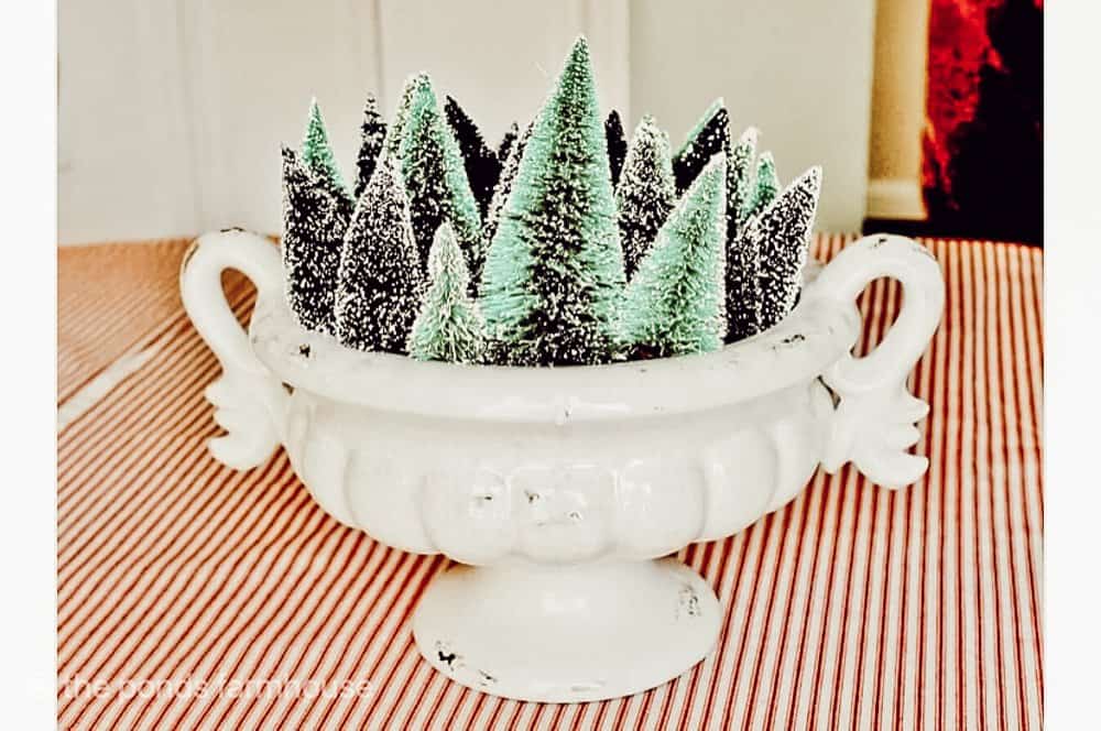 Cheap Home Decor with a thrift store find tureen filled with bottle brush trees.  