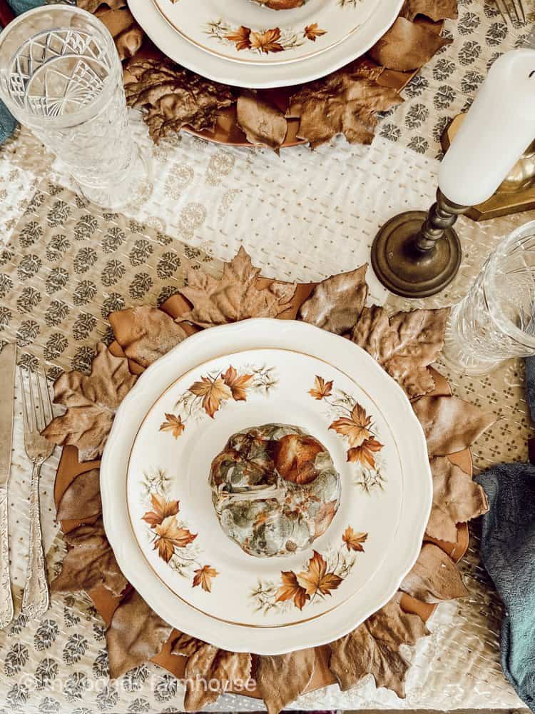 Place setting with Copper Leaf Plate Chargers and Napkin Decoupage Pumpkins