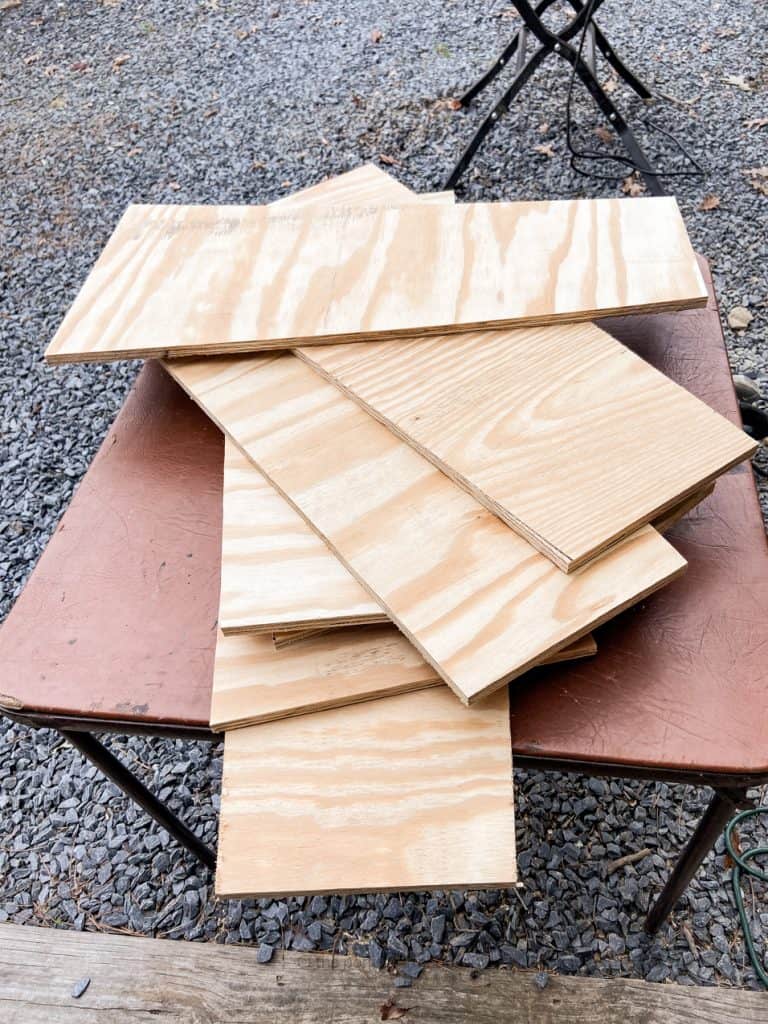 Cut plywood into pieces for DIY planters
