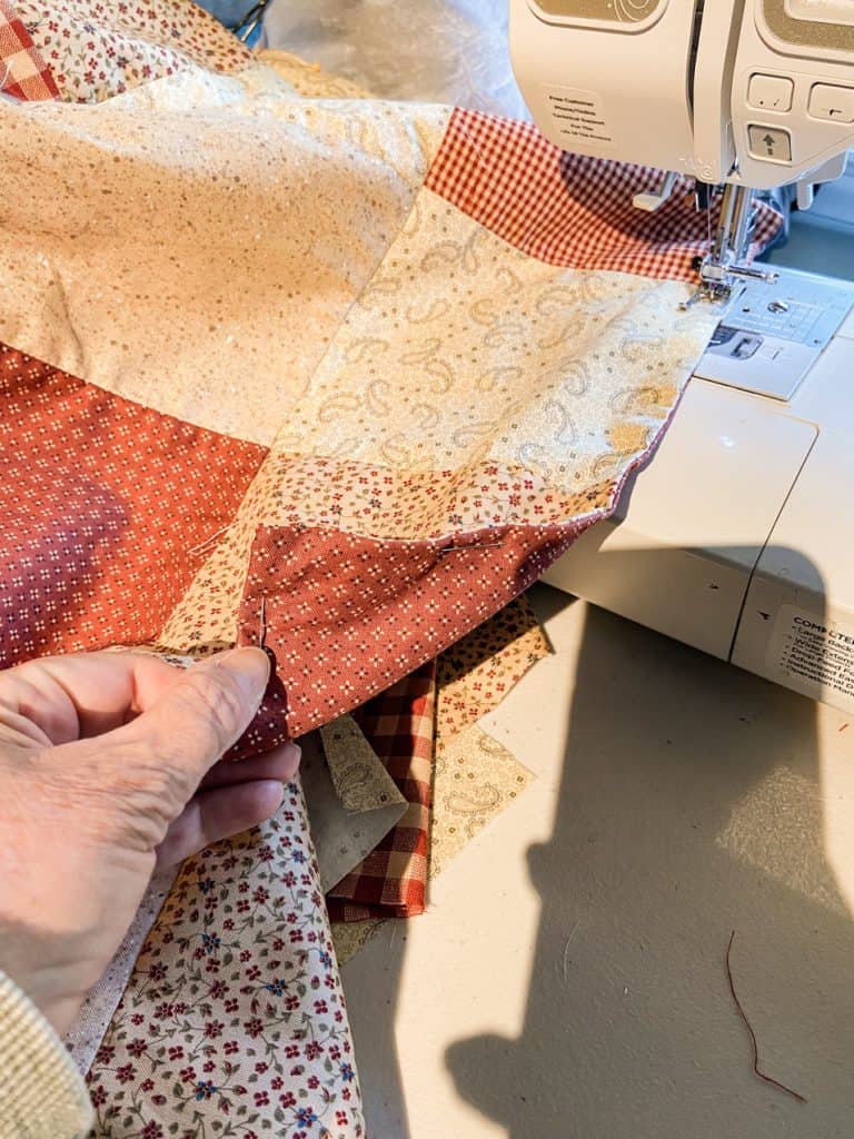 Stitch the top and bottom pieces of table cloth together