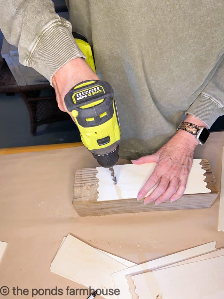Drill a hole in the precut wooden boards.