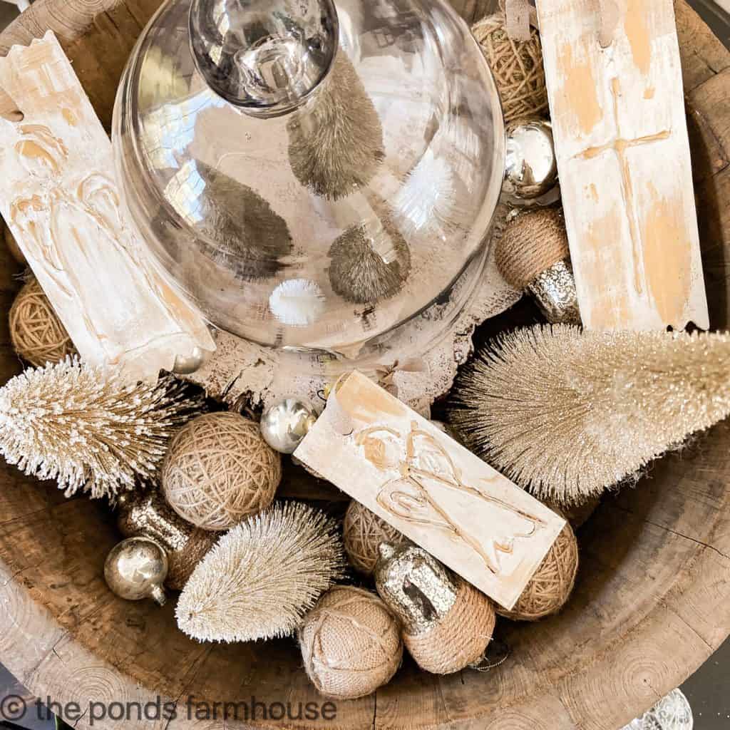 Hot Glue Painted Wood Ornaments in a bowl of Christmas decor.