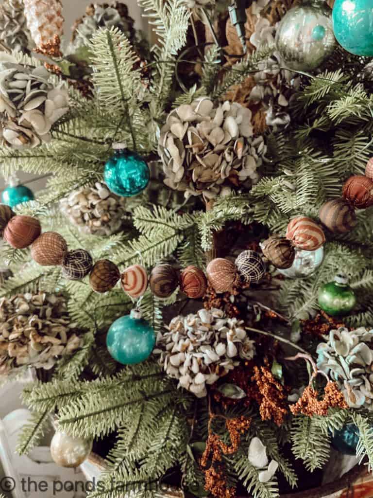 Close up view of dried hydreangeas and vintage ornaments on Christmas Tree. Rag Garland for Farmhouse Style