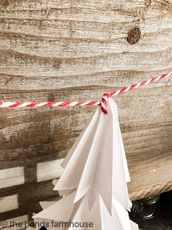 sting the diy paper Christmas trees together for a creative garland