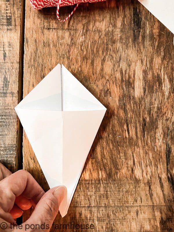 Show how to fold the paper for the DIY Paper Christmas Trees. 