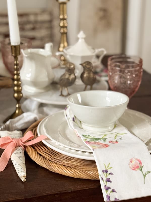 Place setting with neutral whites and pale pinks.