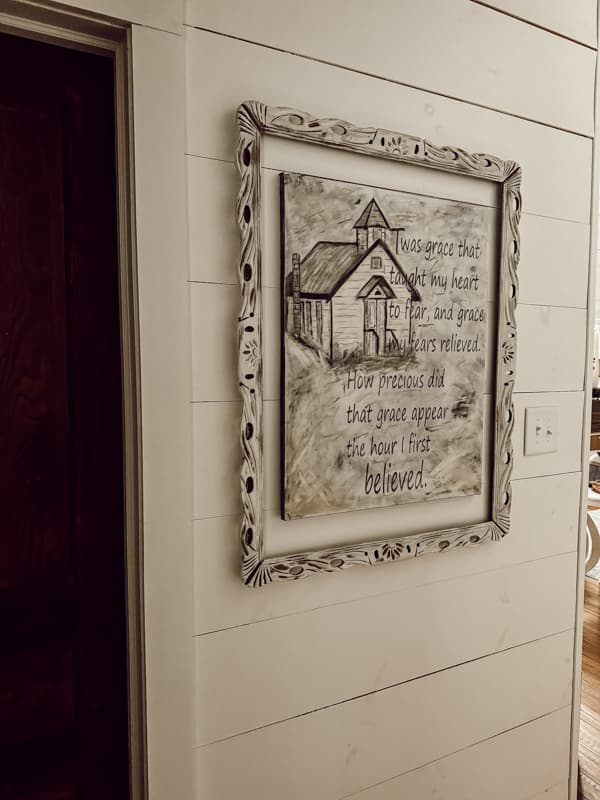 Old mirror frame surrounds a church painting for thrift store tips.  