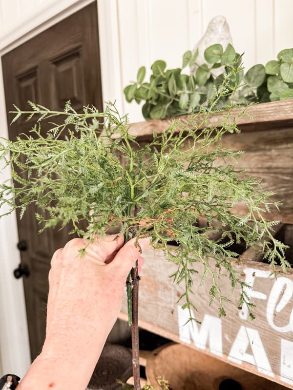 Wrap wire around the faux stems to attach them to the foraged stick base.  