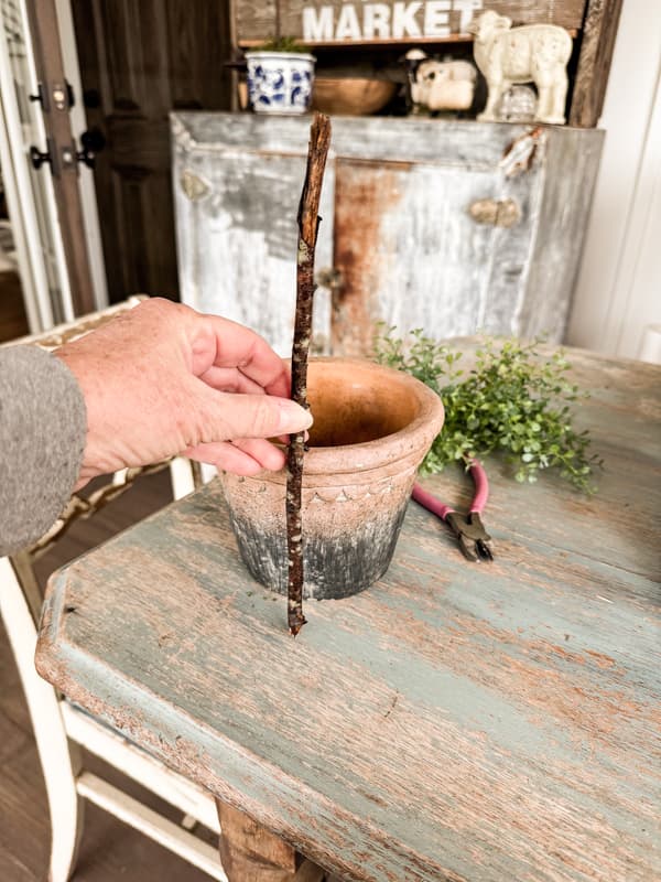 Use stick for base and measure with pot for height.  