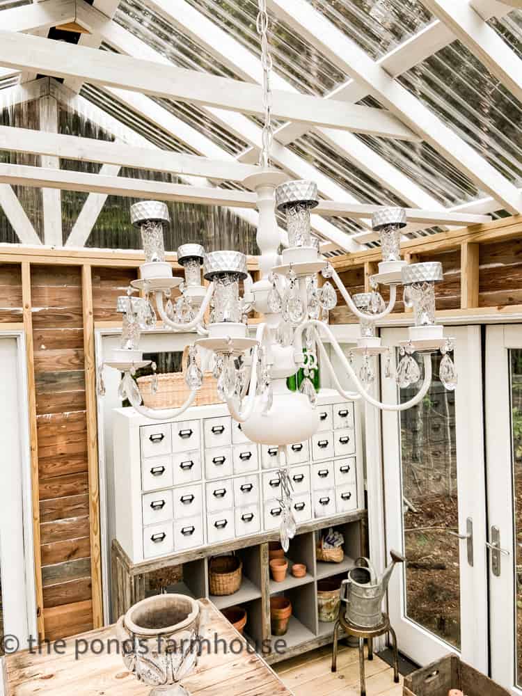 Upcycled Chandelier in Greenhouse. Thrift store Tips for repurposing your finds.  