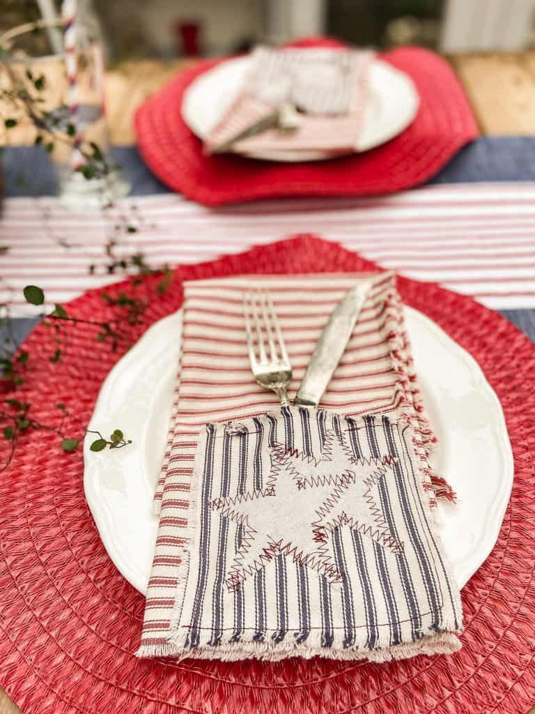 DIY Patriotic Napkins made from ticking fabric scraps work perfectly on the festive fourth of july tablescape