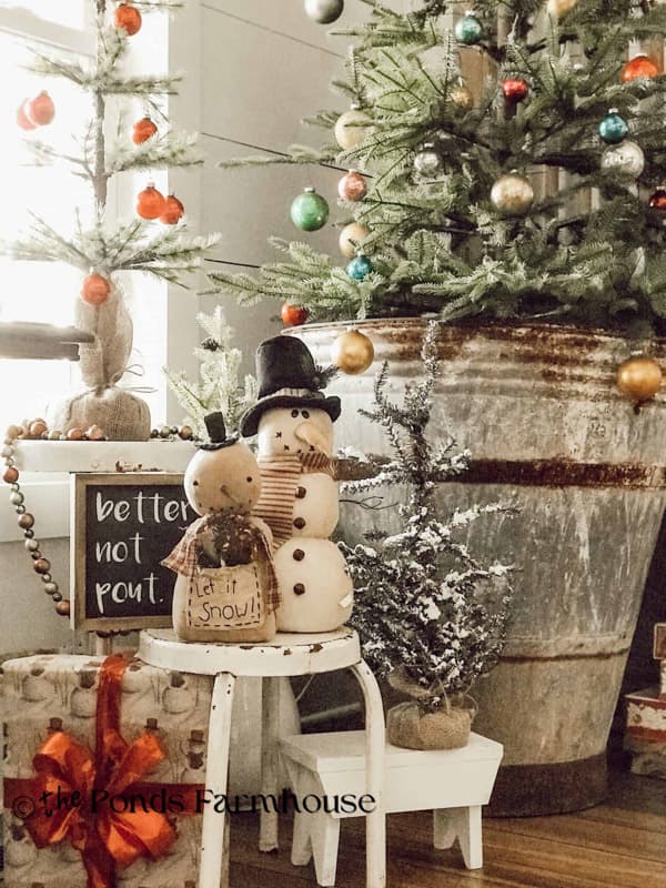Decorations around Christmas tree base with vintage Christmas Past Theme