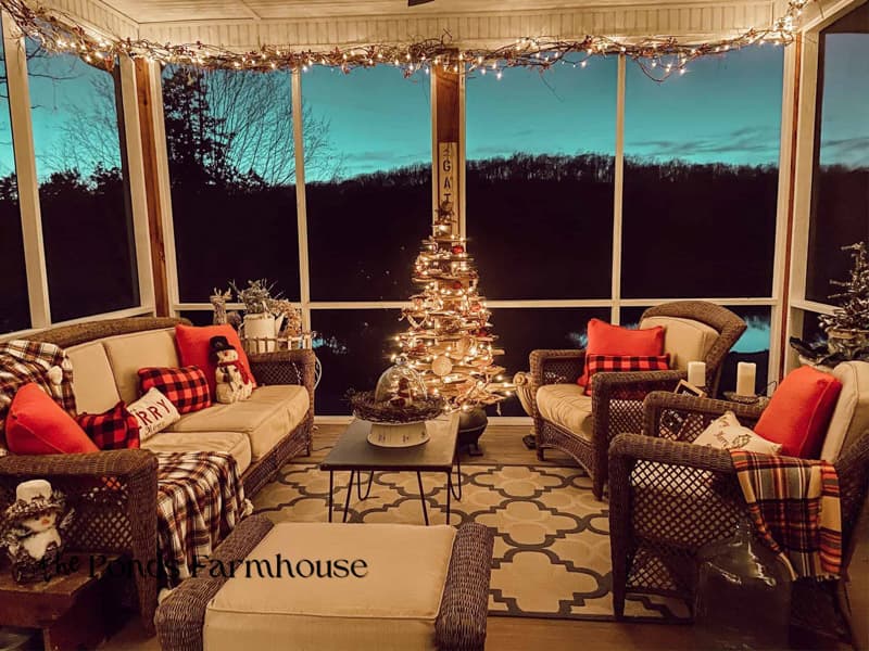 Evening View of Screened porch decorated for Christmas Past
