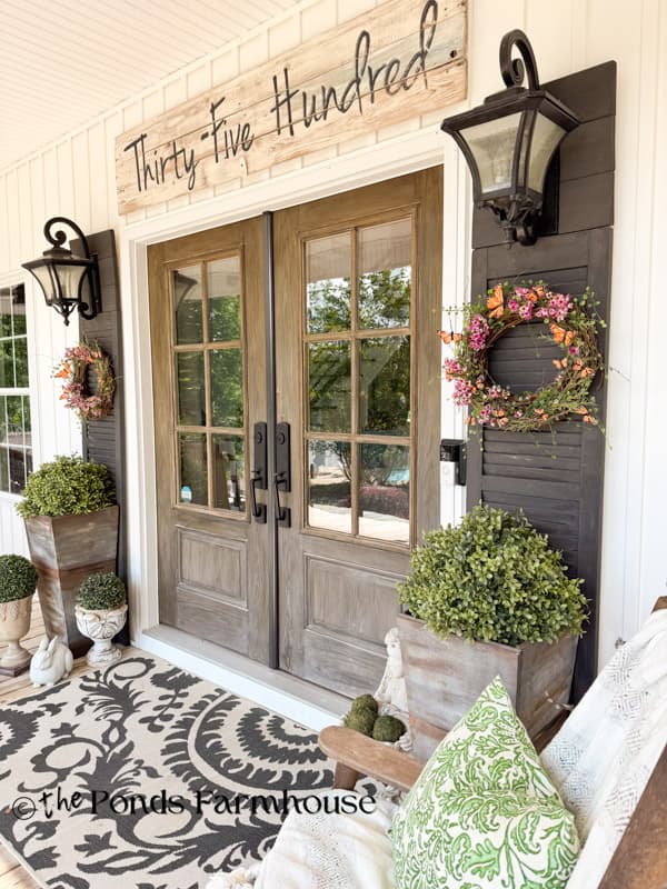 Front porch with butterfly wreaths for summer