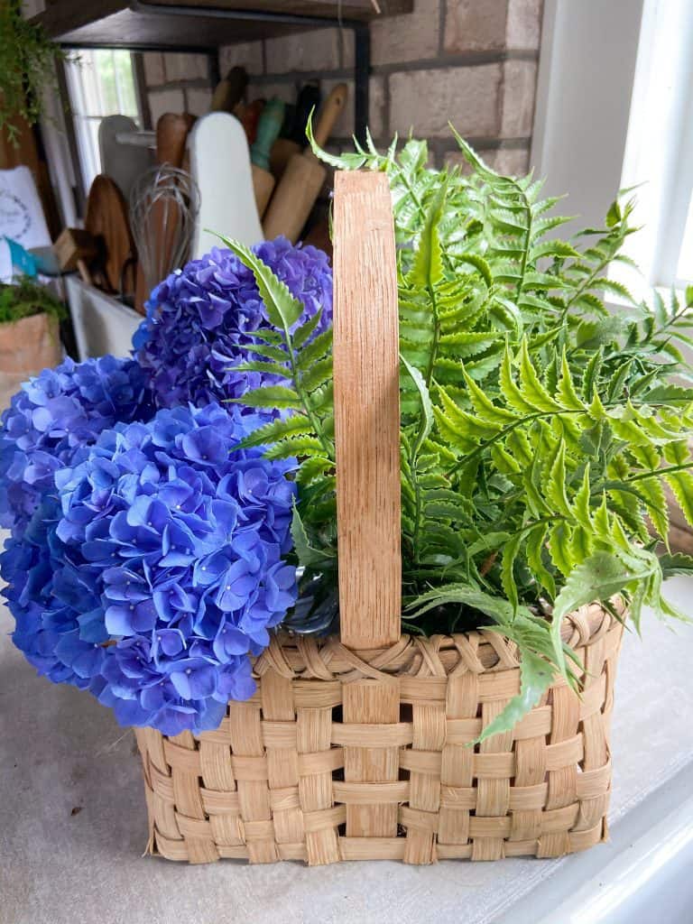 Adding fresh hydrangeas and faux fern makes this arrangement easy to maintain.  
