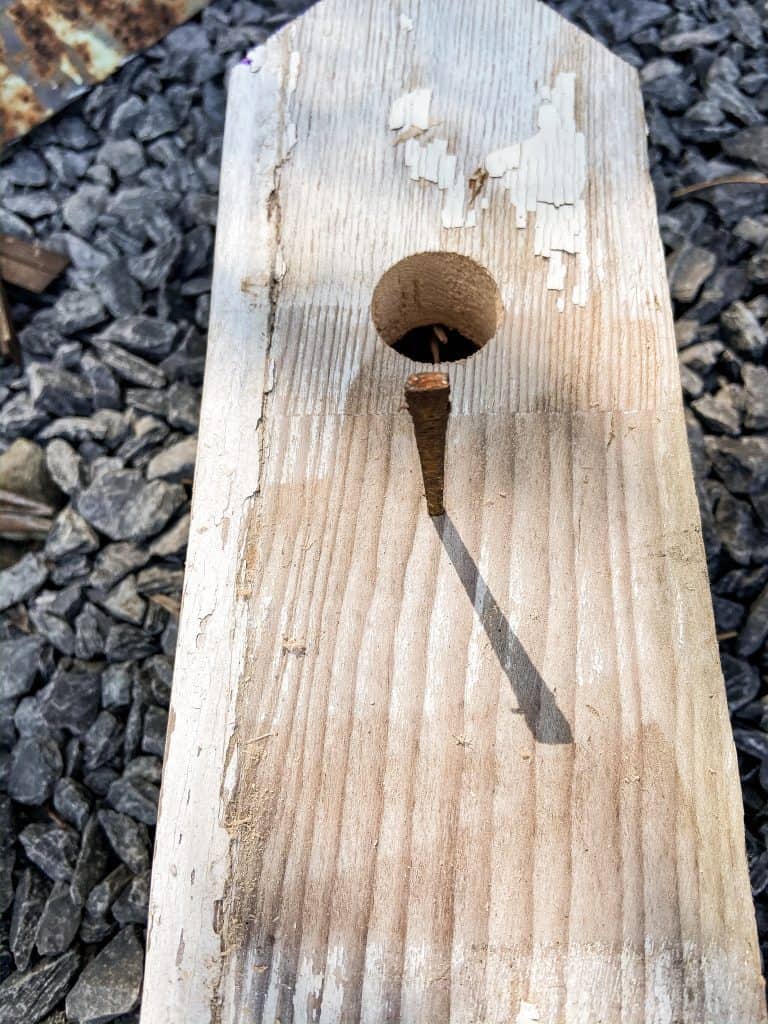 Antique nails pulled from old ship lap were added to the rustic birdhouse