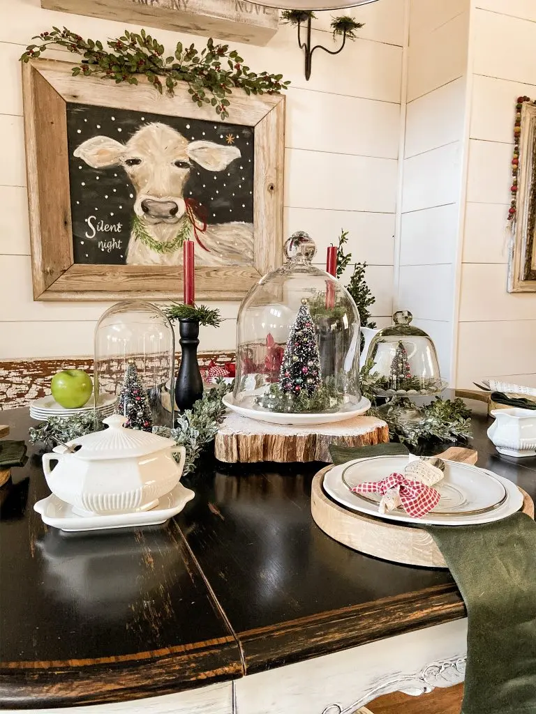 Cow Painting and Vintage Inspired Bottle Brush Trees create a beautiful holiday table.  