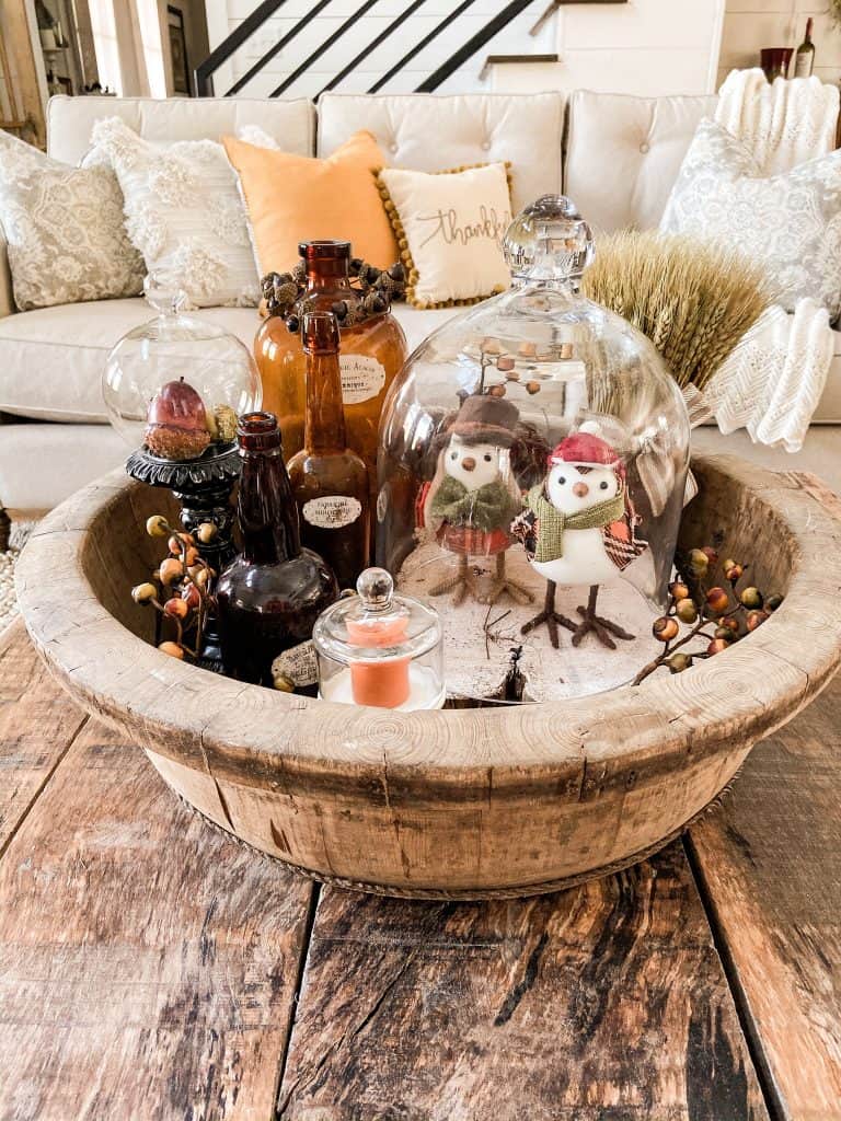 Wait until you see all the ways you can decorate with glass cloches for this fall.  Combine cloches, amber bottles and more to create a beautiful fall vignette.  Rustic Farmhouse Style decorating