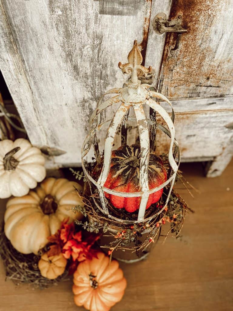 Even garden cloches are more interesting with a pumpkin inside.  Fall Pumpkins, farmhouse style, rustic country decorating.  
