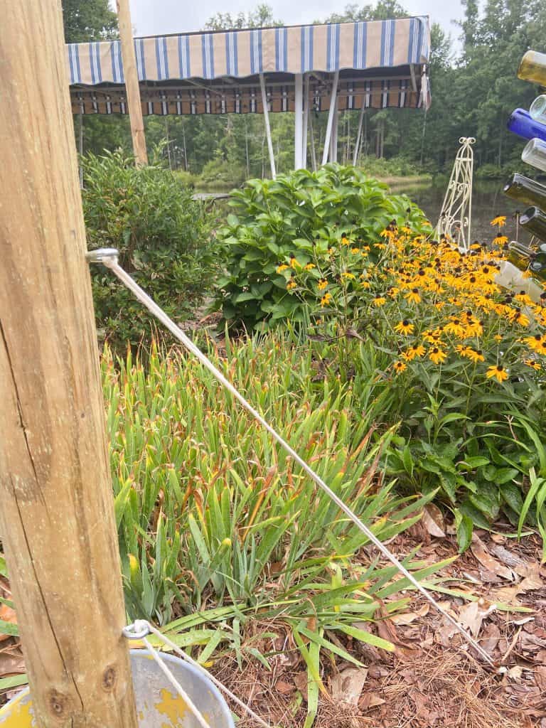 The DIY Portable String Light Posts may need additional anchors to prevent tipping.  Perfect for the patio area.  Country Life, Farmhouse Style