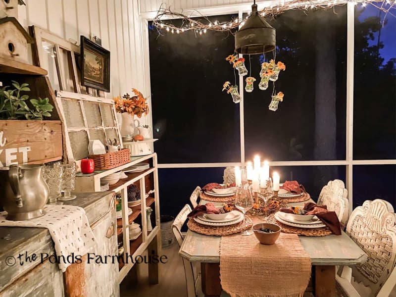 evening view of tablescape on screened porch