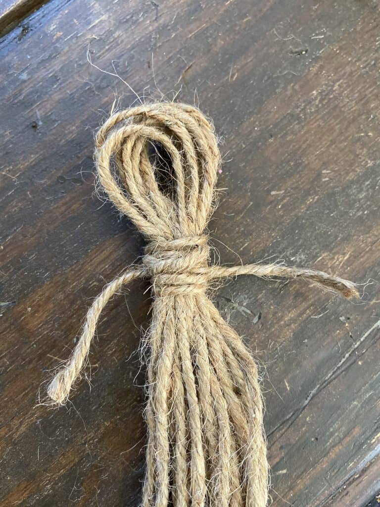 Tie rope around top of tassel
