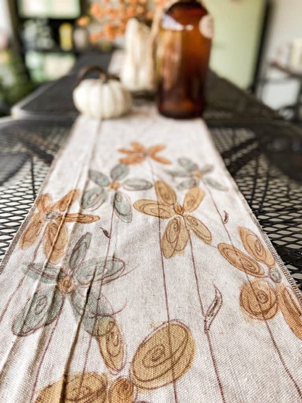 Hand-painted DIY Tablecloth Runner on outdoor kitchen table.  