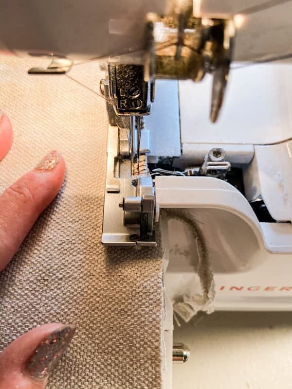 Use serger to trim the edges of the table runner