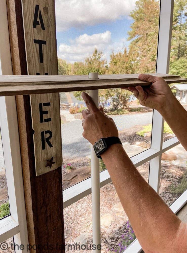 Adding a center post to hold the shiplap christmas tree together.  Wood Christmas Tree