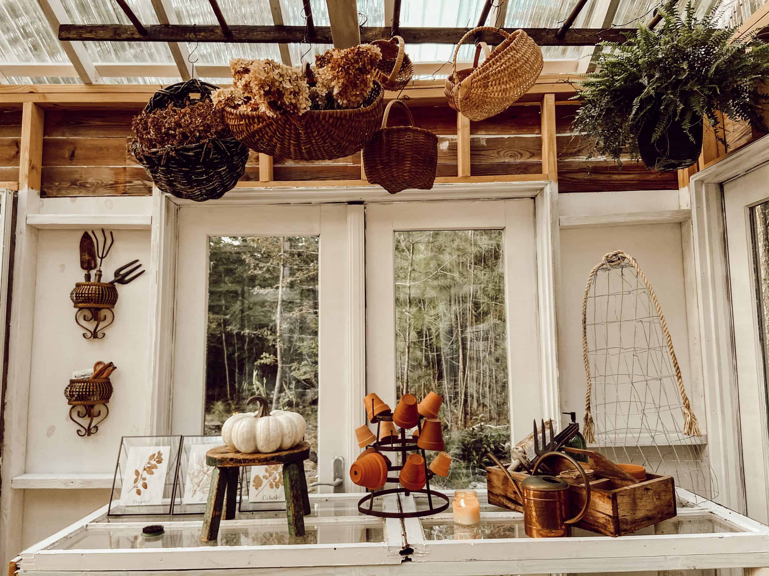 Fall Greenhouse with ladder filled with thrifted baskets.