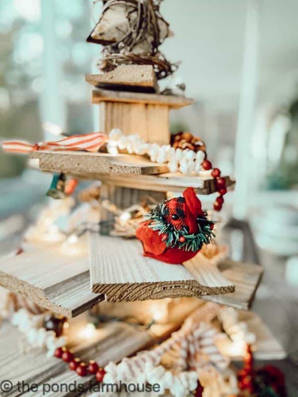 Red bird ornament on wooden shiplap tree