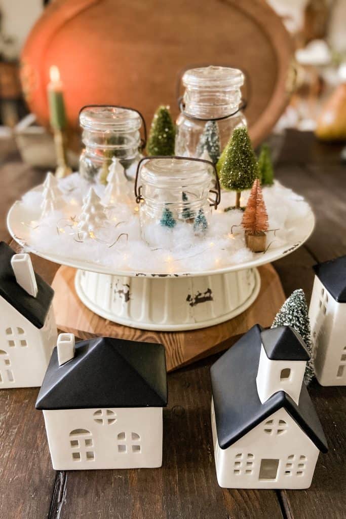 Here's how to make a couple different Christmas Snow Scene in a Jar.  First, using thrift store and dollar store items and then using vintage mason jars and a cake stand. Cheap and easy ways to decorate for Christmas. 